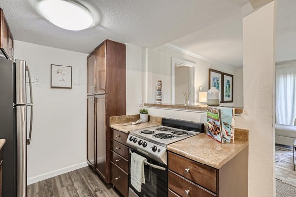 Avantus Apartments: Modern kitchen with sleek countertops and stainless steel appliances