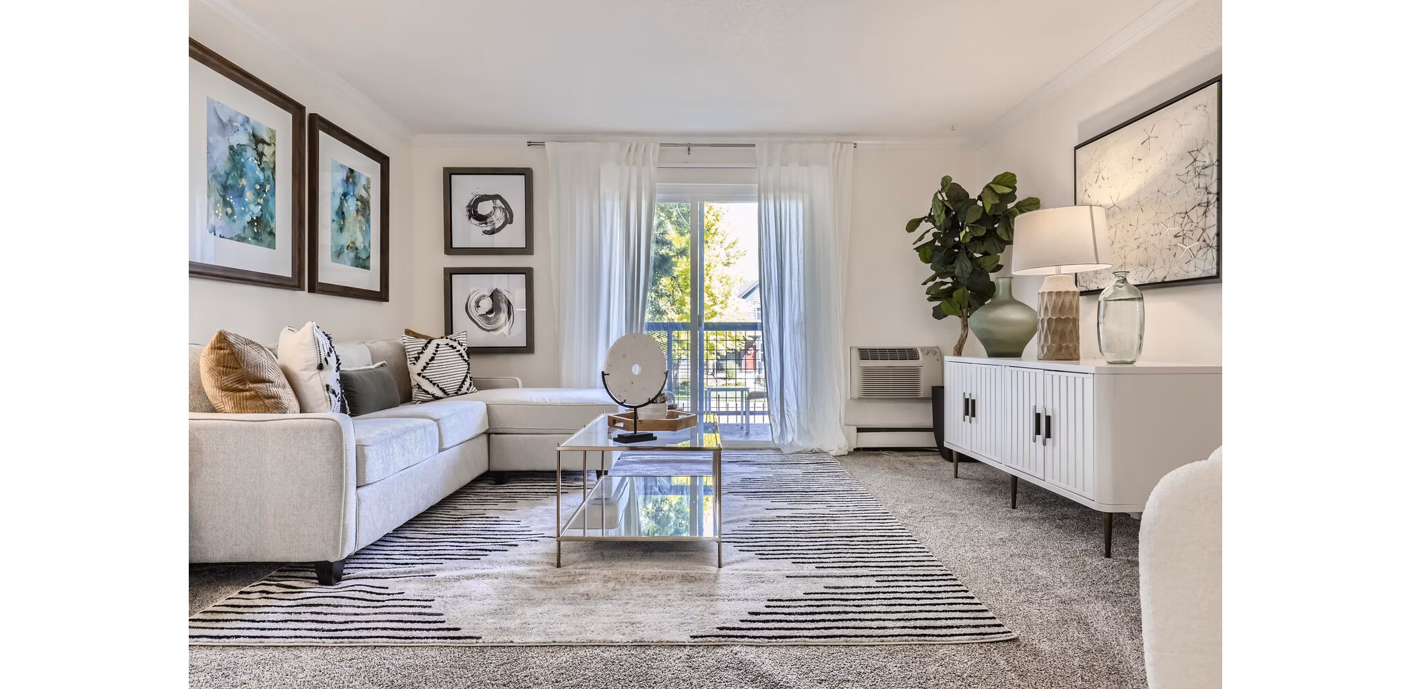 Stylish living room with modern furnishings at Avantus Apartments
