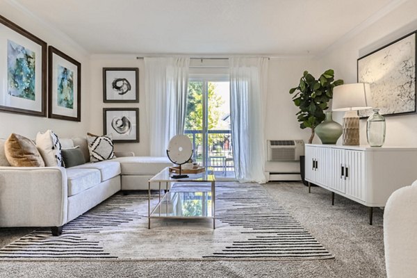 Stylish living room with modern furnishings at Avantus Apartments