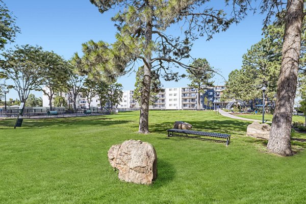 Tranquil courtyard surrounded by lush greenery at Avantus Apartments, offering a peaceful retreat in the heart of the city