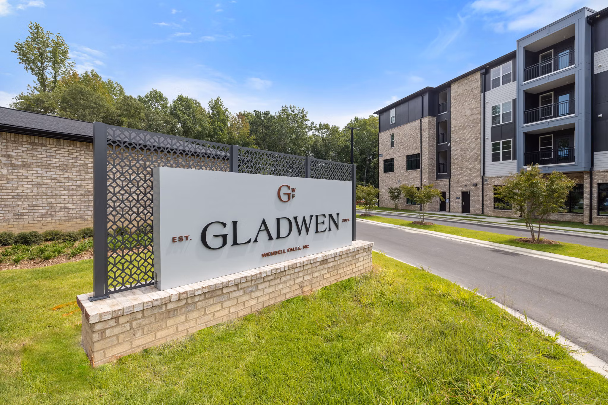 Gladwen Wendell Falls Apartments: Elegant property signage in a serene community setting