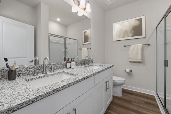 Bathroom with modern fixtures and sleek design at Gladwen Wendell Falls Apartments