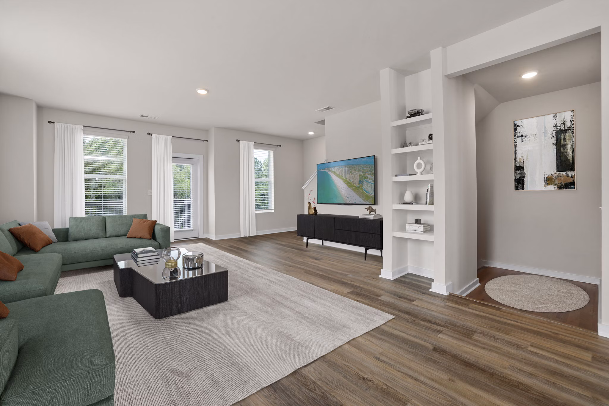 Lobby featuring contemporary design and cozy seating at Gladwen Wendell Falls Apartments