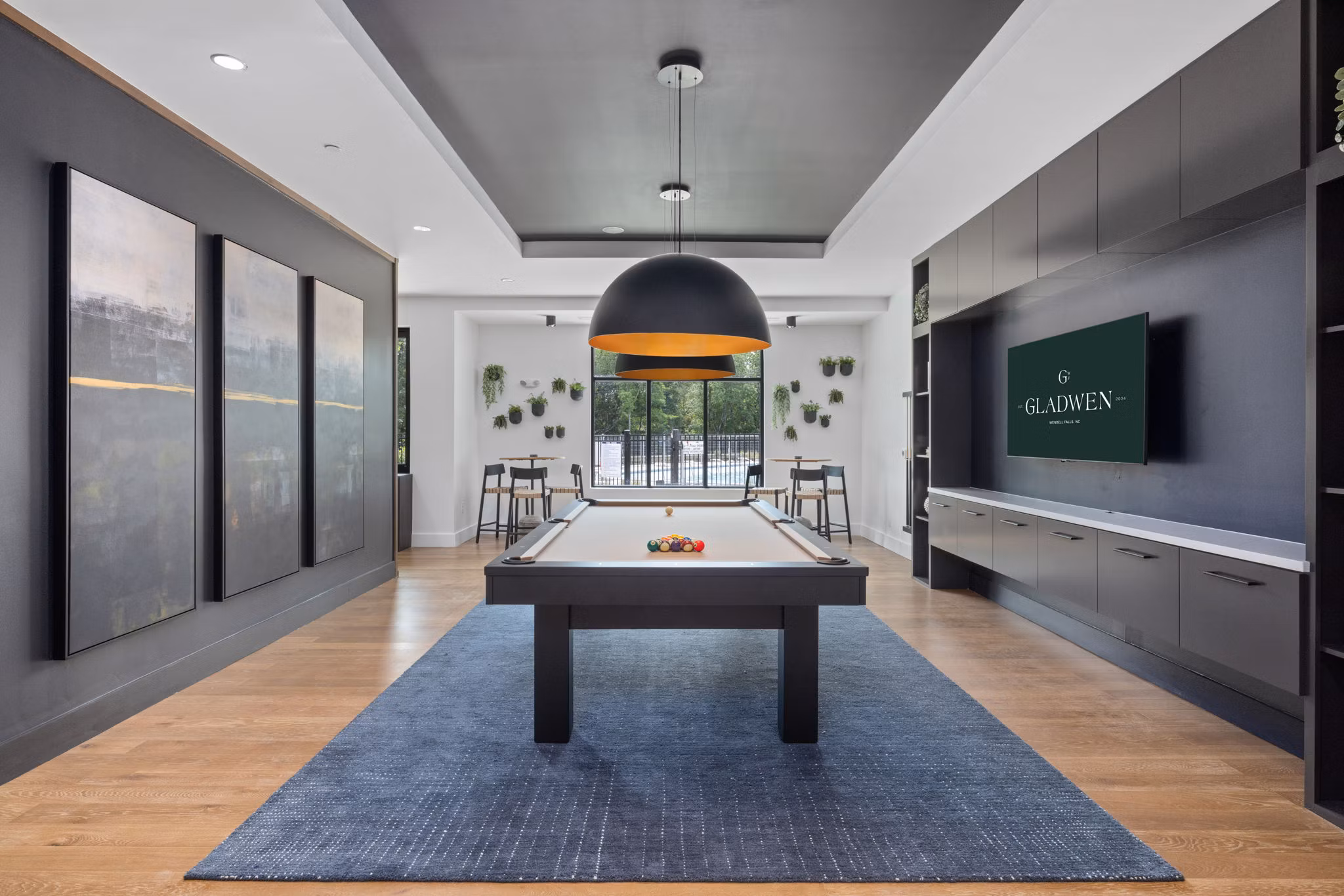 Game room featuring pool table and arcade games at Gladwen Wendell Falls Apartments