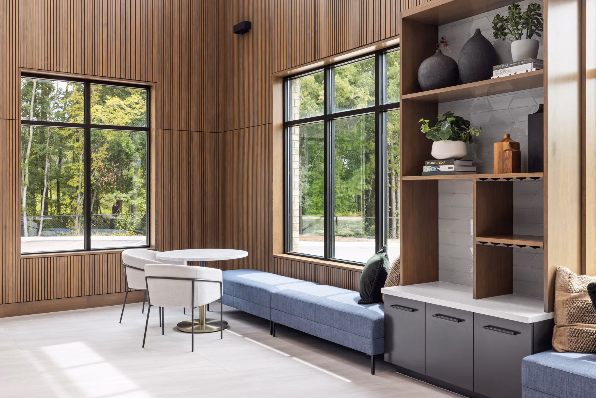 Lobby with stylish seating and modern dÃ©cor at Gladwen Wendell Falls Apartments, a Greystar luxury community