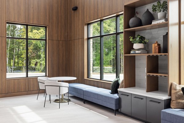 Lobby with stylish seating and modern dÃ©cor at Gladwen Wendell Falls Apartments, a Greystar luxury community