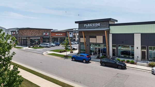 Gladwen Wendell Falls Apartments: Lush green spaces and walkways in vibrant, family-friendly neighborhood