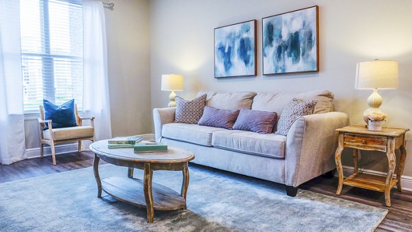 Spacious living room with modern decor in Windsor at Manhattan Apartments