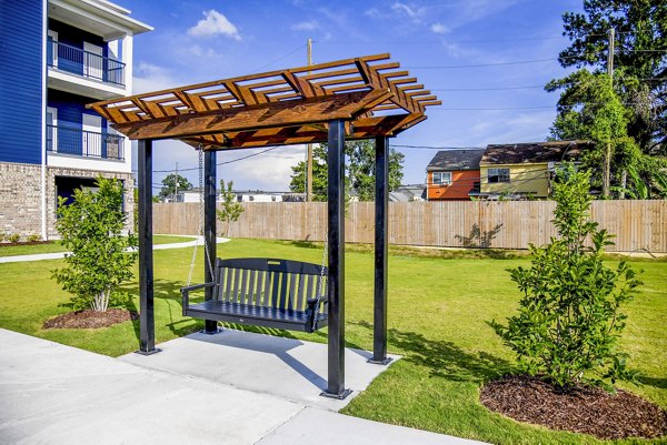 Spacious outdoor grill and patio area at Windsor at Manhattan Apartments, perfect for entertaining and relaxation
