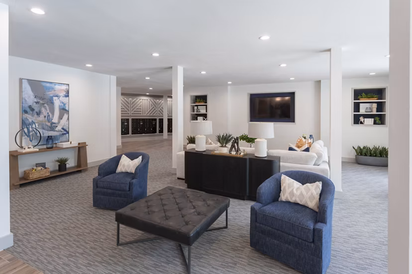 Clubhouse with comfortable seating and billiards table at Broadstone Baybrook Apartments, ideal for social gatherings and relaxation