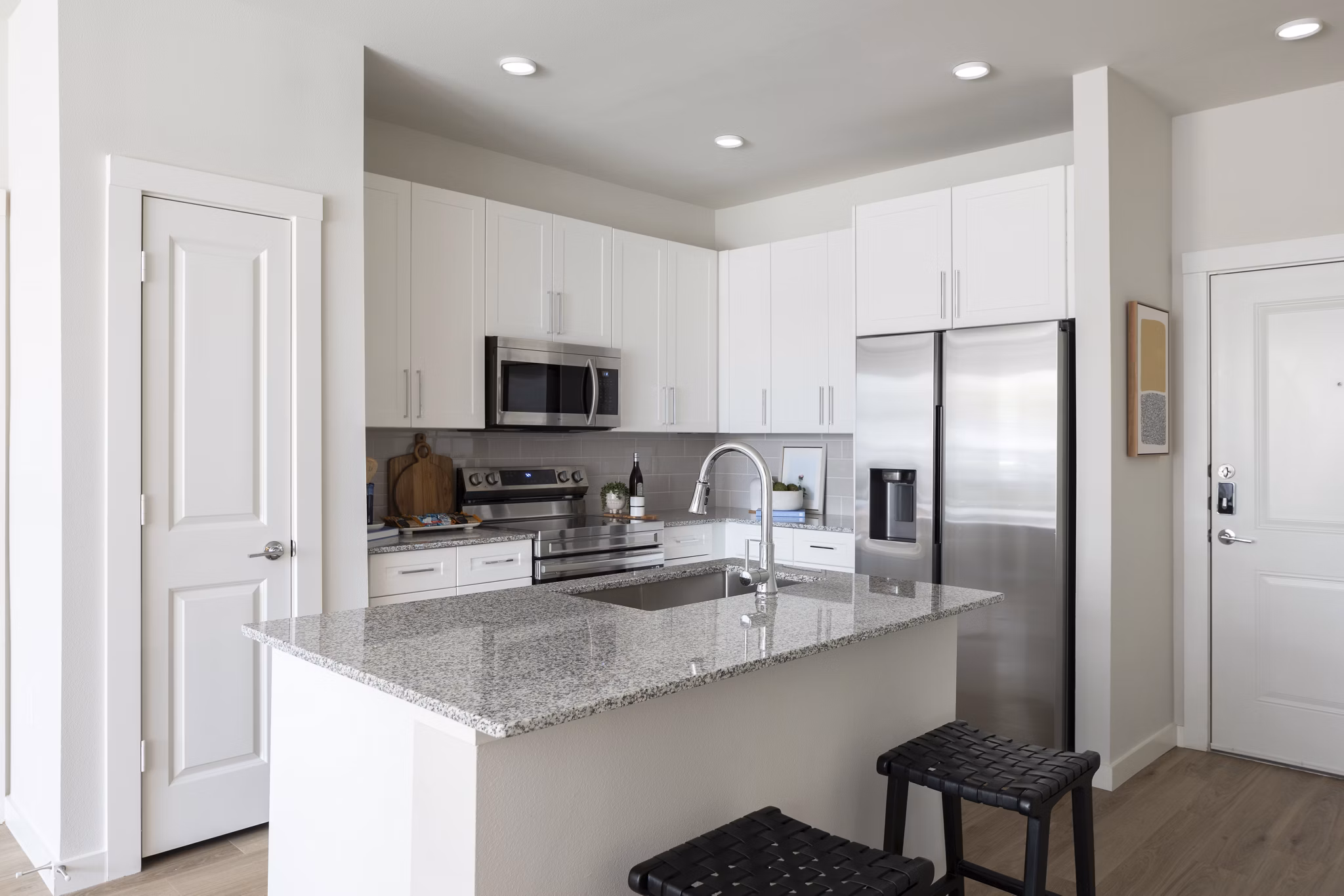 Kitchen with modern appliances and sleek cabinetry at Broadstone Baybrook Apartments