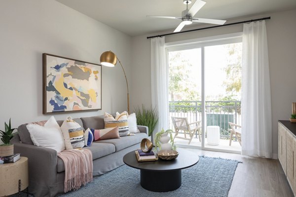 Spacious living room with modern decor and natural light at Broadstone Baybrook Apartments