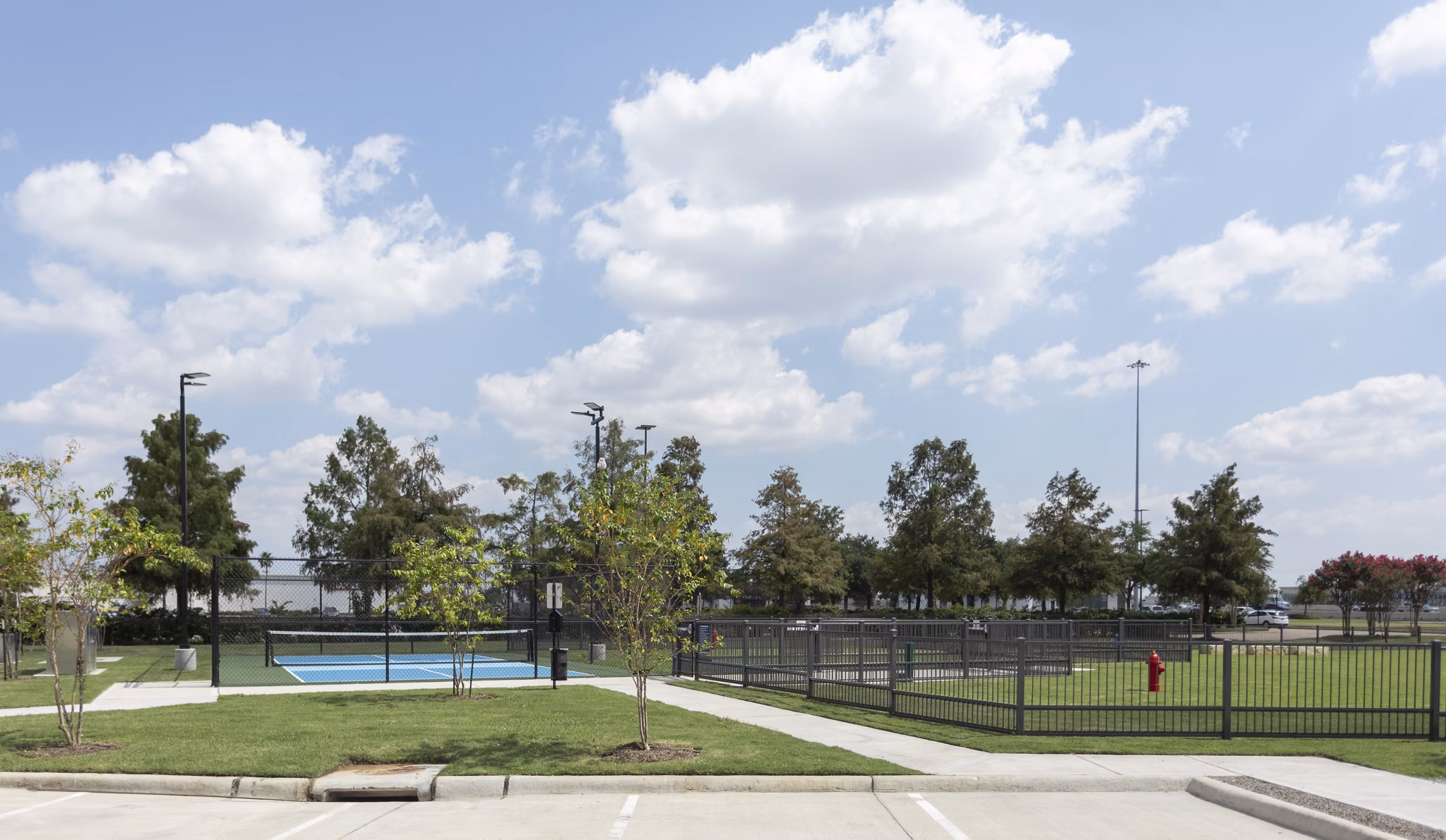 Outdoor sport court for basketball and tennis at Broadstone Baybrook Apartments