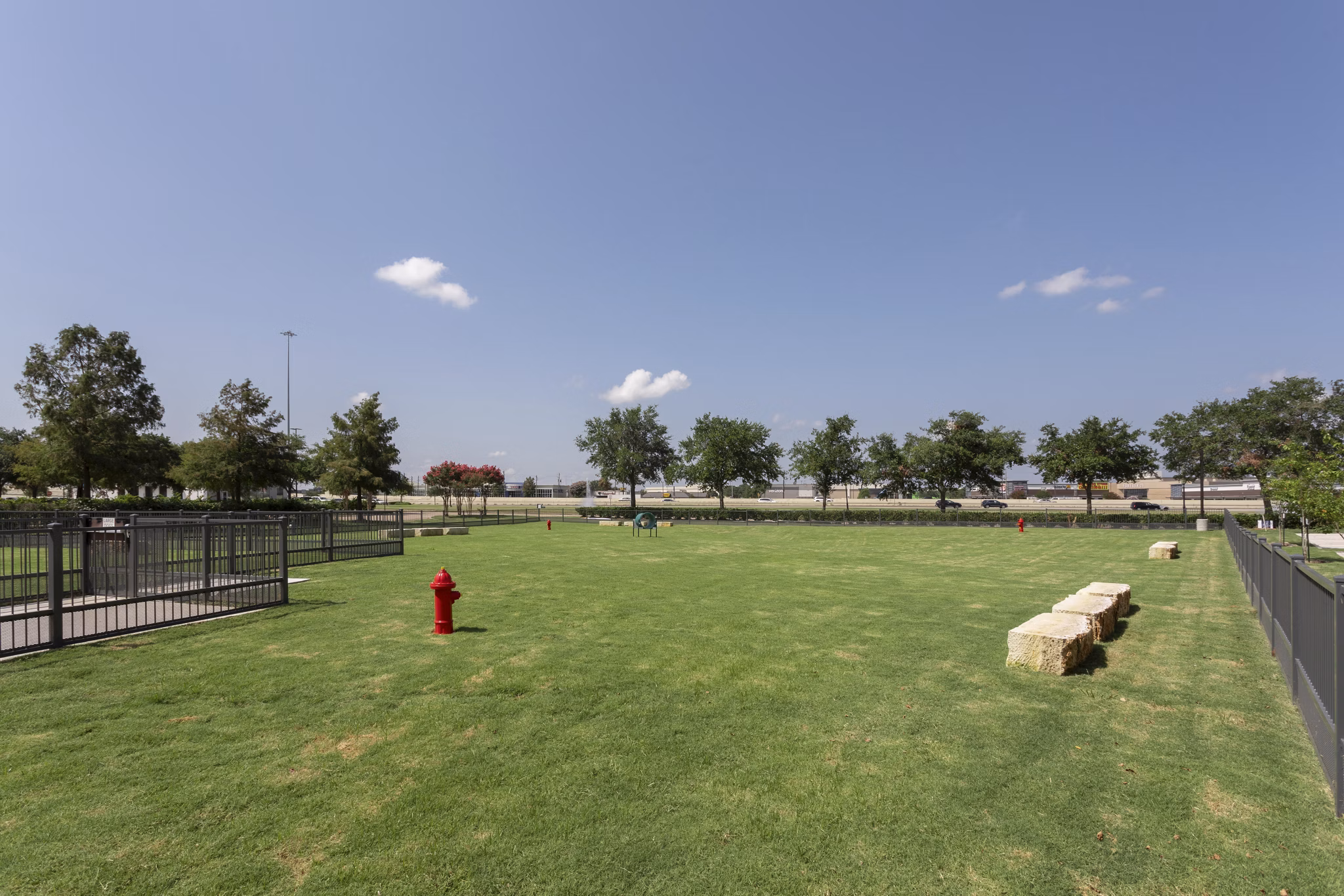 Scenic dog park with agility equipment at Broadstone Baybrook Apartments, perfect for pet-friendly living spaces