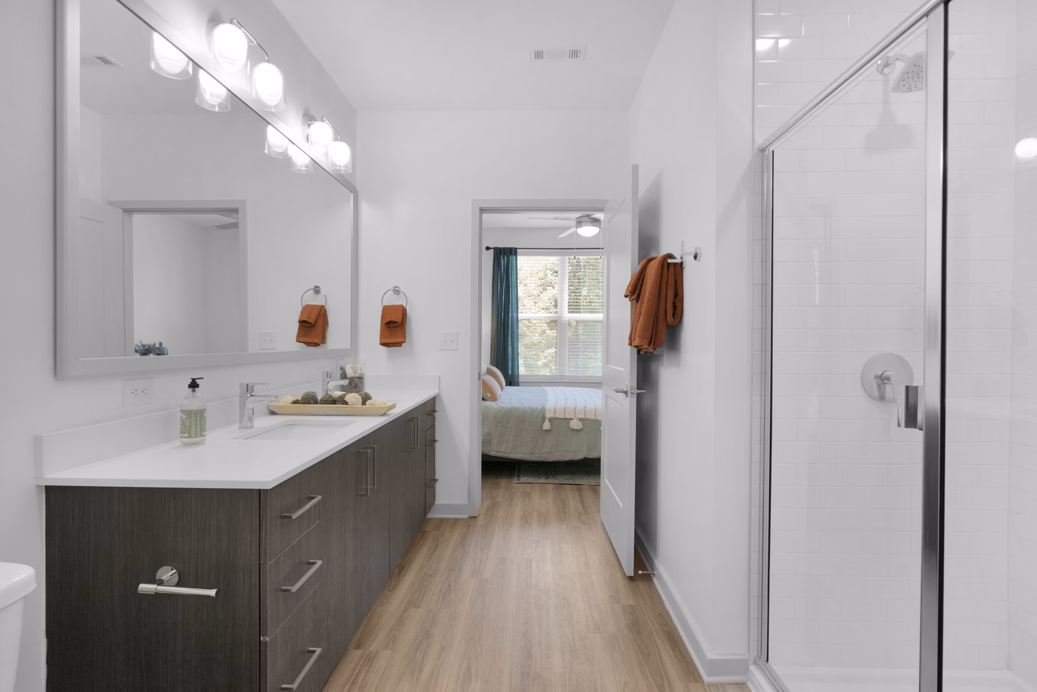 Luxurious bathroom with modern fixtures at Alexan Research Park Apartments
