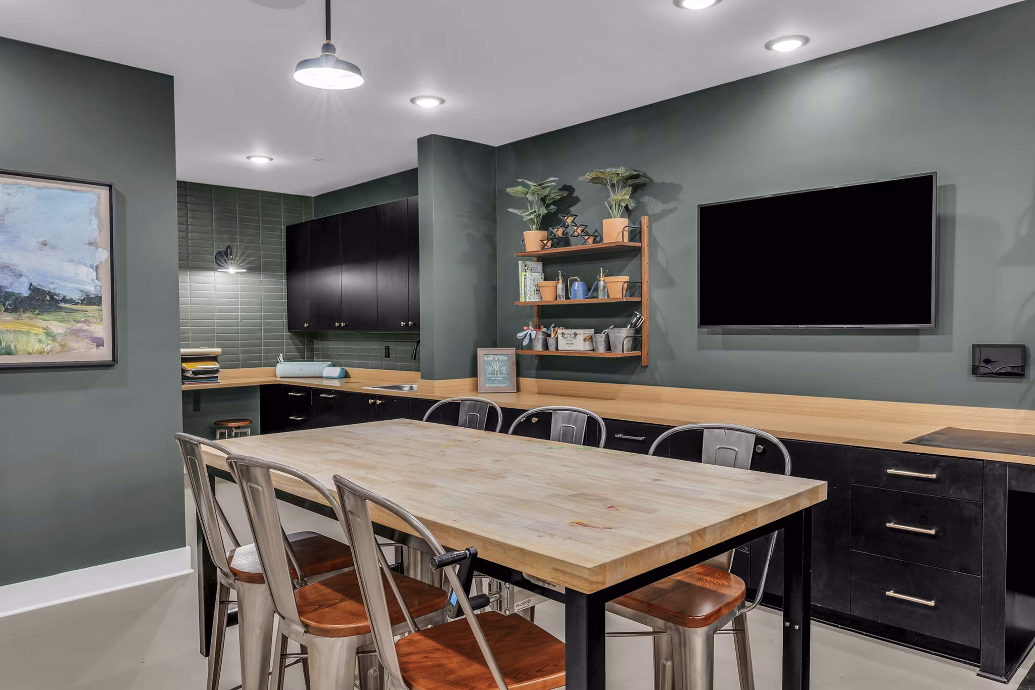 Modern clubhouse featuring stylish furnishings at Alexan Research Park Apartments