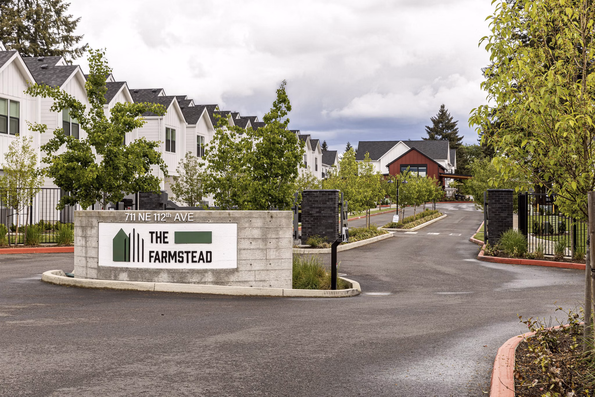 Signage at The Farmstead Apartments: Entrance sign at luxury apartments in vibrant neighborhood