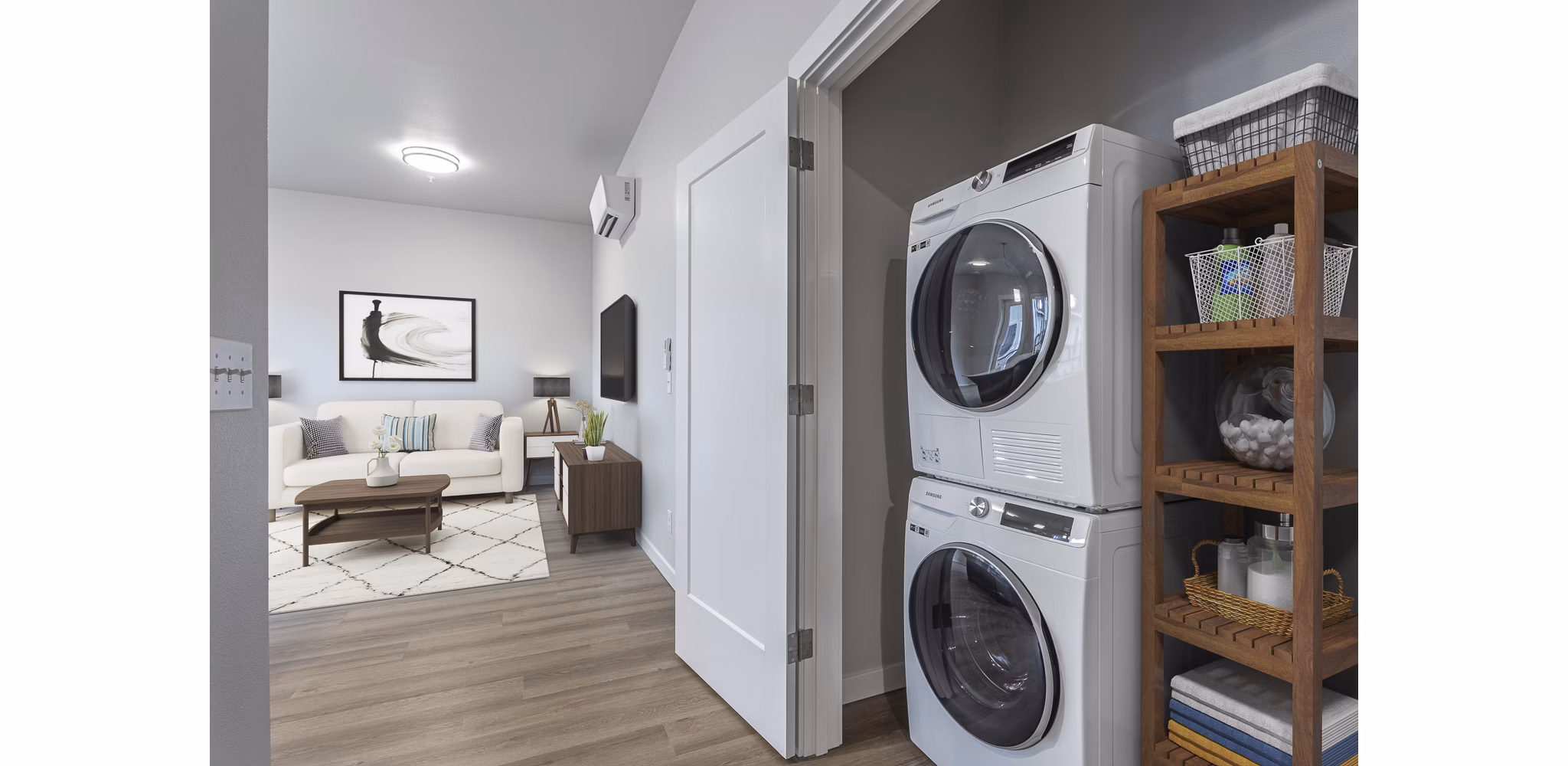 Laundry room with modern appliances at The Farmstead Apartments, Greystar luxury apartments