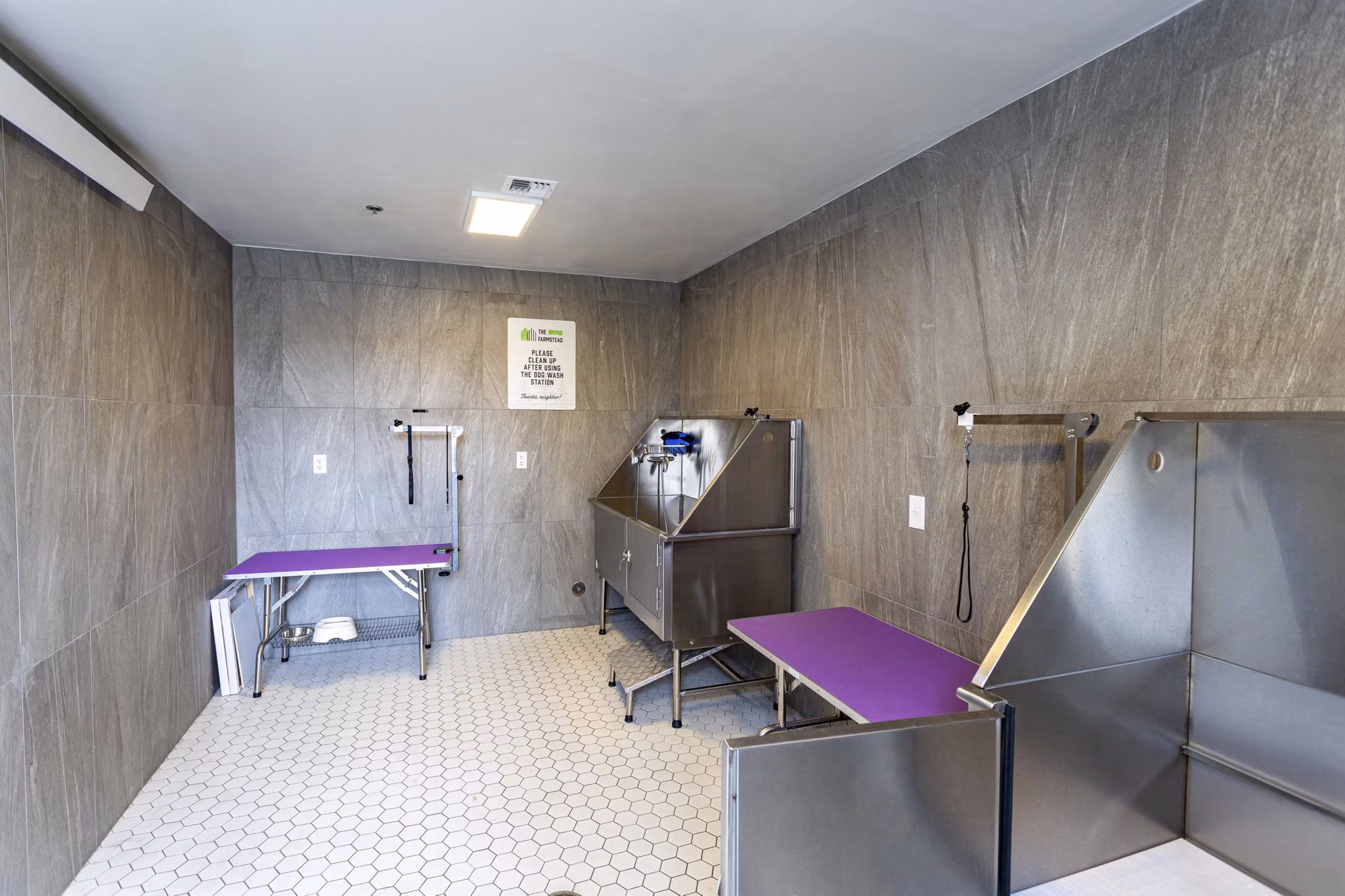 Dog wash station with grooming amenities at The Farmstead Apartments, ideal for pet owners seeking convenience in luxury living