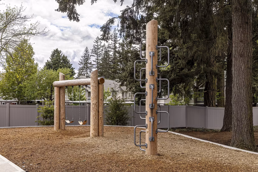 playground with vibrant play structures at The Farmstead Apartments