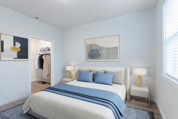 Cozy bedroom with modern decor at Villas at 28th Apartments