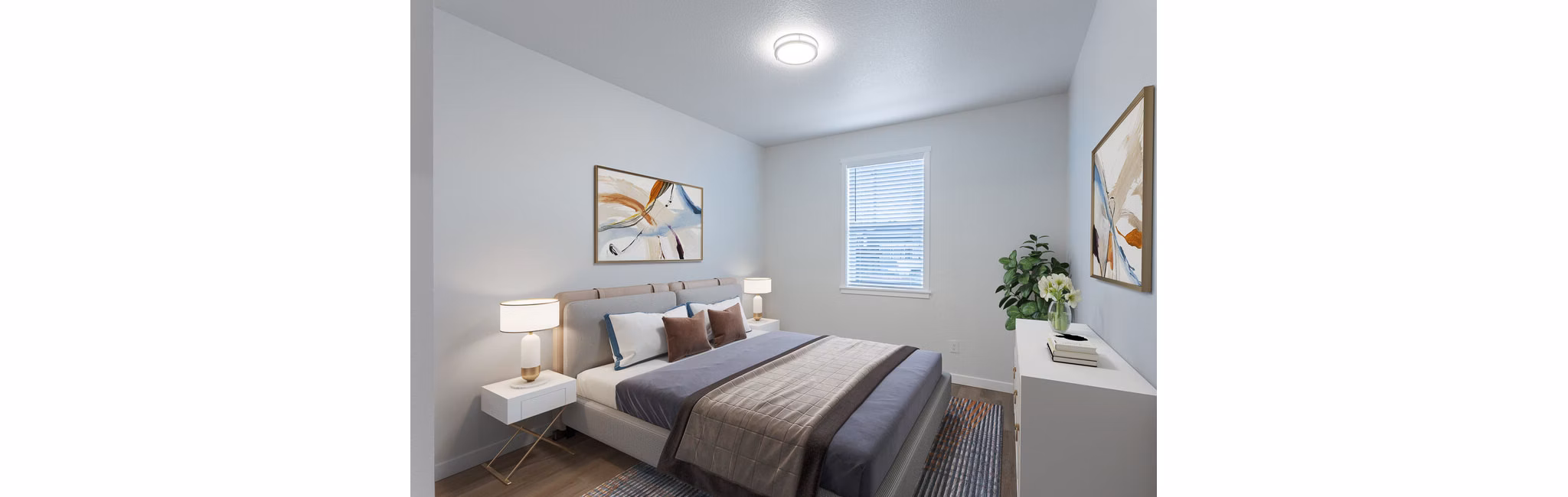 Bedroom featuring modern decor and large windows at Villas at 28th Apartments