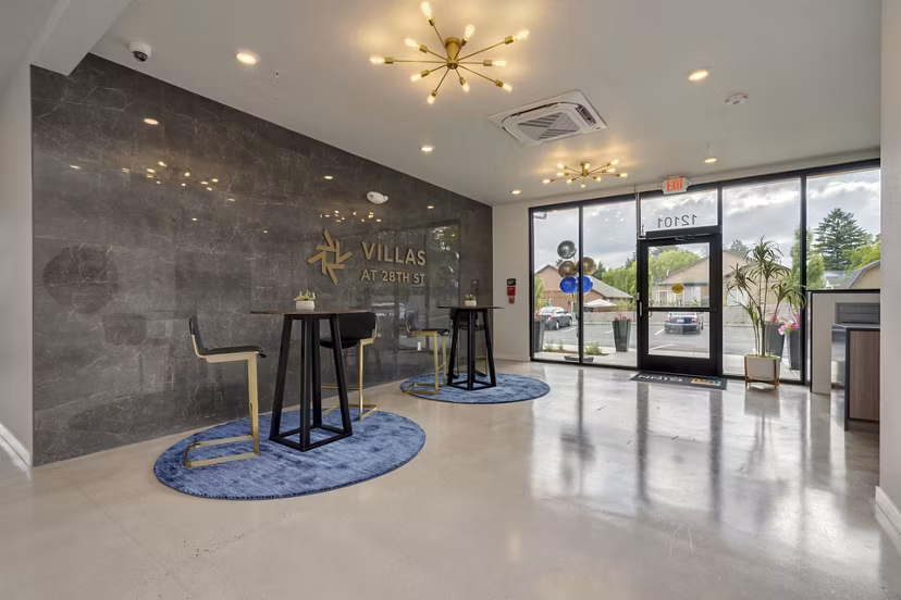 Stylish clubhouse featuring a modern lounge area at Villas at 28th Apartments