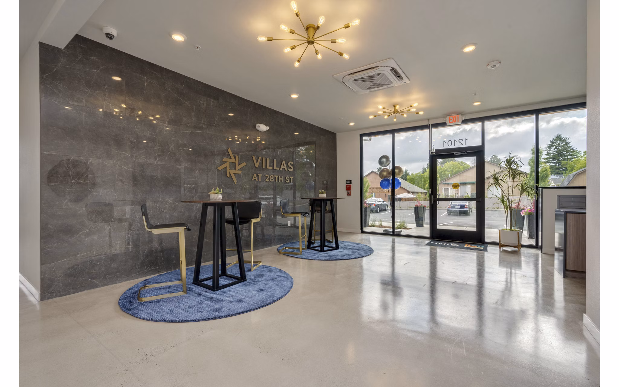 Stylish clubhouse featuring a modern lounge area at Villas at 28th Apartments