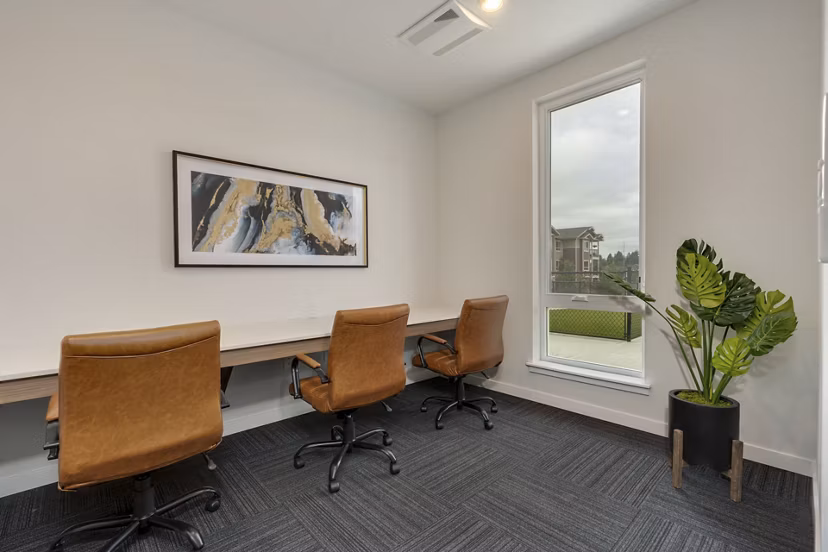 Clubhouse featuring modern design and spacious seating at Villas at 28th Apartments, ideal for community gatherings and relaxing social events