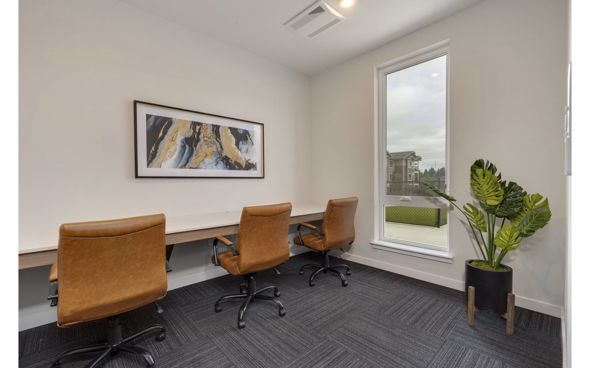 Clubhouse featuring modern design and spacious seating at Villas at 28th Apartments, ideal for community gatherings and relaxing social events