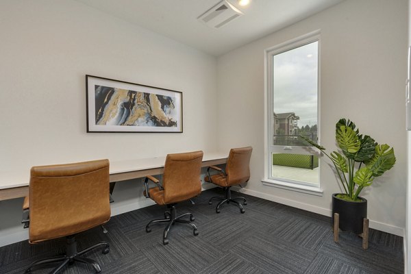 Clubhouse featuring modern design and spacious seating at Villas at 28th Apartments, ideal for community gatherings and relaxing social events