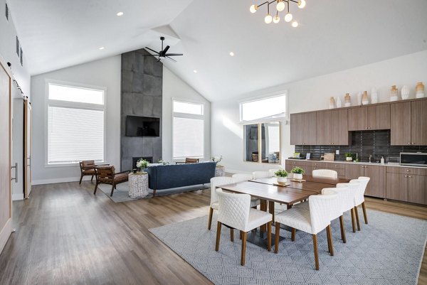 Clubhouse with contemporary design at Villas at 28th Apartments, featuring spacious seating and modern dÃ©cor