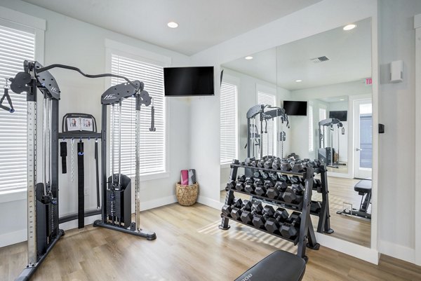 State-of-the-art fitness center featuring modern equipment at Villas at 28th Apartments