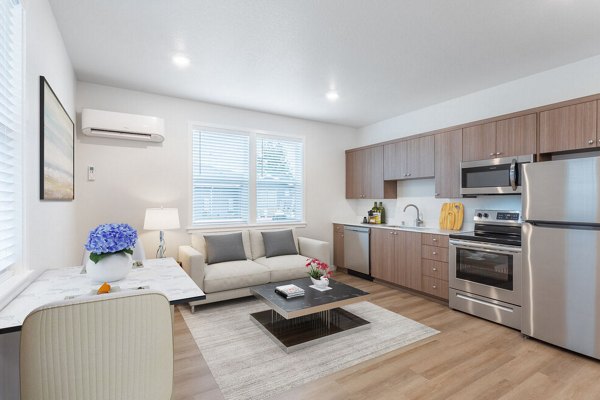 Spacious living room with modern decor at Villas at 28th Apartments