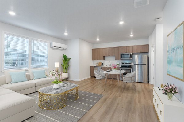 Spacious living room with contemporary decor in Villas at 28th Apartments