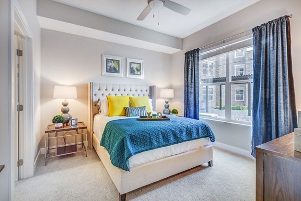 Elegant bedroom with large windows and modern decor at Incline at Anthem Apartments in Henderson