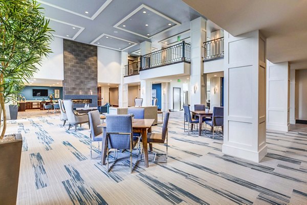 Incline at Anthem Apartments: Stylish clubhouse lobby featuring contemporary furnishings and open seating areas, perfect for social gatherings