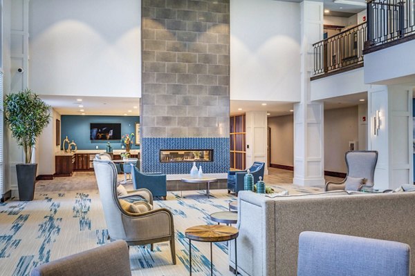 Clubhouse lobby with modern decor and seating area at Incline at Anthem Apartments