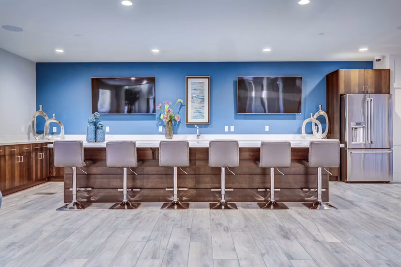 Incline at Anthem Apartments: Elegant clubhouse lobby with modern decor and seating areas