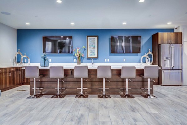 Incline at Anthem Apartments: Elegant clubhouse lobby with modern decor and seating areas