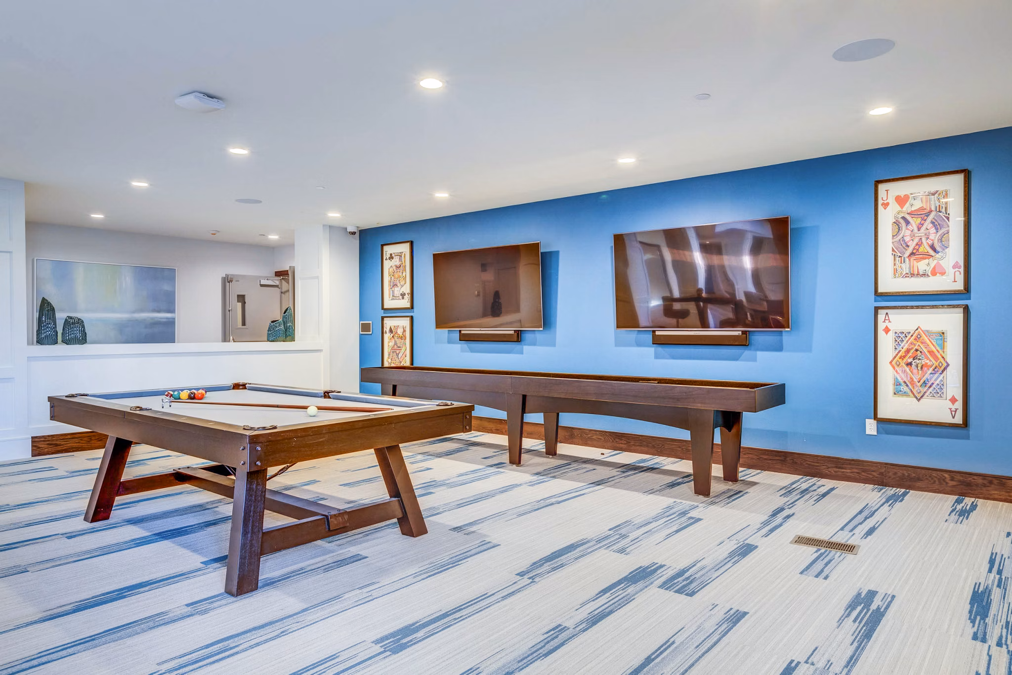 Game room with pool table and lounge seating at Incline at Anthem luxury apartments