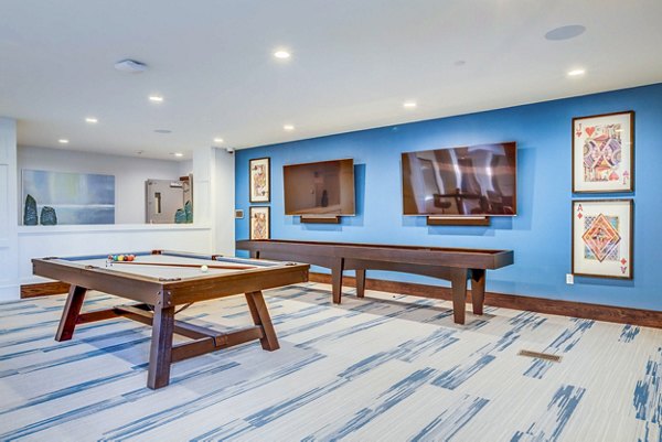 Game room with pool table and lounge seating at Incline at Anthem luxury apartments