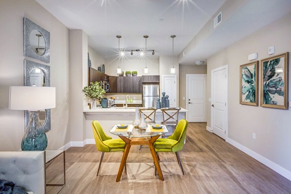 Dining area featuring modern decor and elegant lighting in Incline at Anthem Apartments