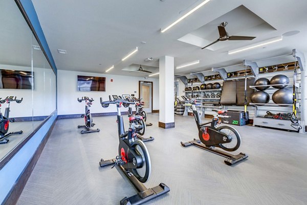 Yoga/spin studio with modern equipment at Incline at Anthem Apartments, offering fitness options for residents focused on wellness and an active lifestyle