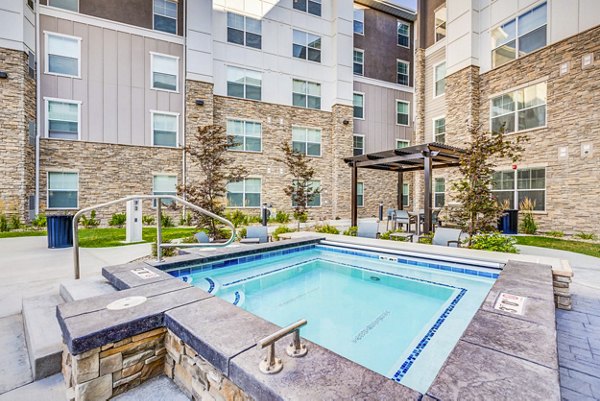 Resort-style pool with sundeck at Incline at Anthem Apartments
