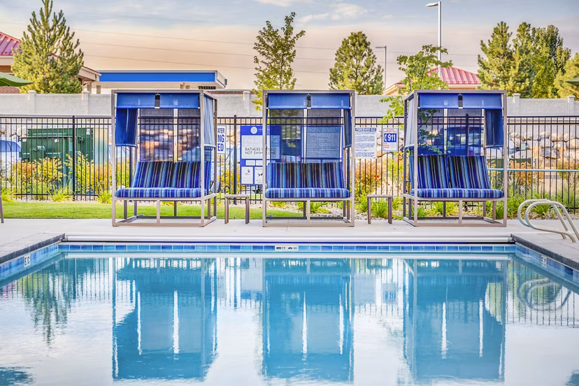 Serene outdoor pool area at Incline at Anthem Apartments, luxury living near vibrant city life
