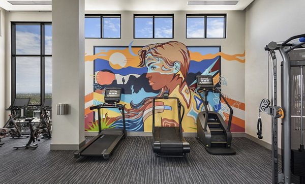 Well-equipped fitness center with modern machines at Derby Apartments for resident wellness and exercise routines