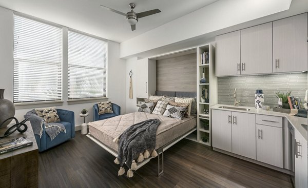 Spacious kitchen featuring modern appliances and marble countertops at Derby Apartments
