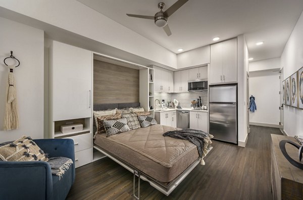 Elegant kitchen with modern appliances and countertops in Derby Apartments