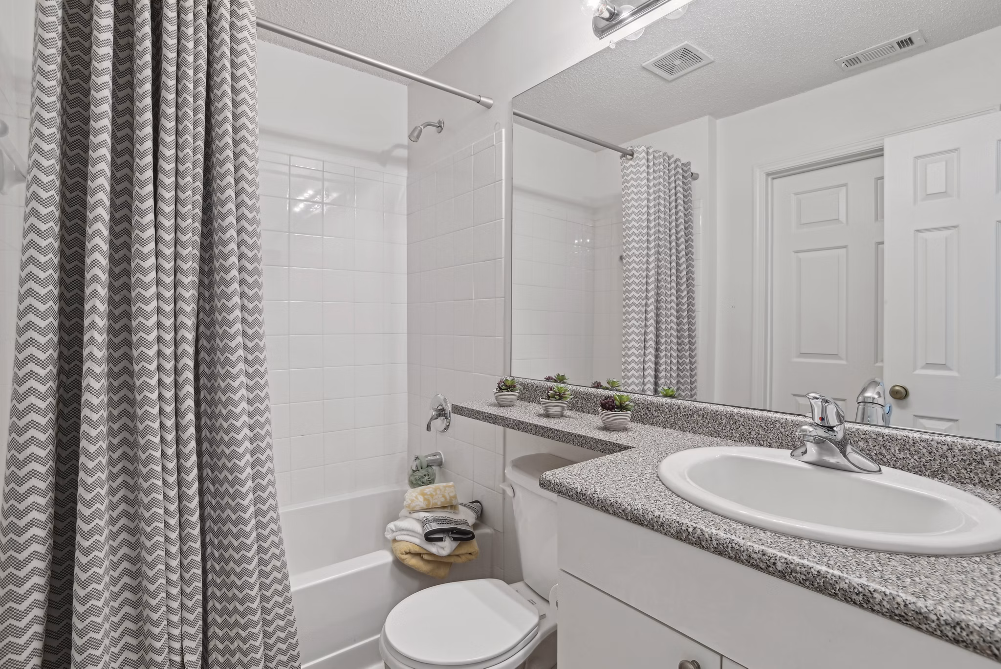 Bathroom with modern fixtures at The Vinings at Duncan Chapel Apartments, offering luxury living and convenience for residents